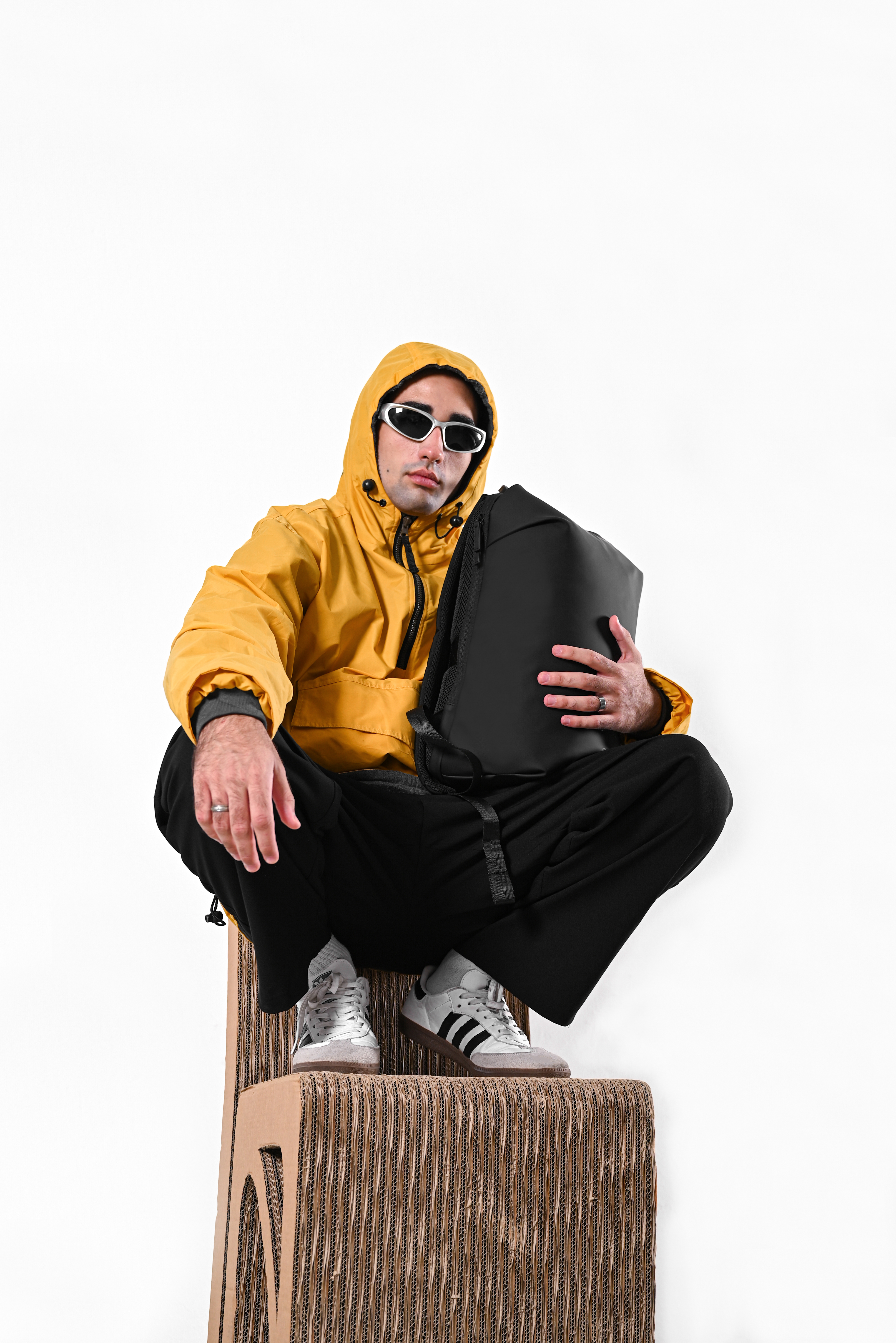 Eloria Como Backpack Black worn by model seated